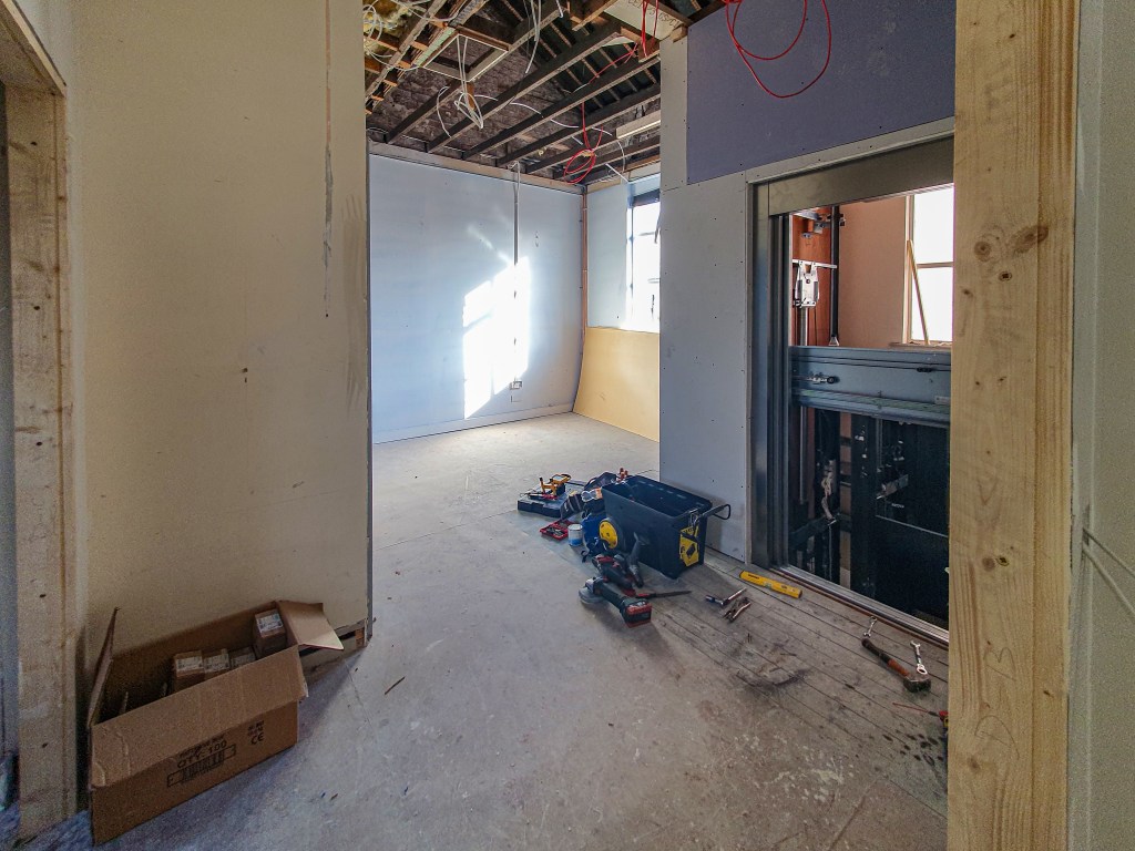 Farset Labs lounge/first floor lobby, with a view of the lift being worked on.